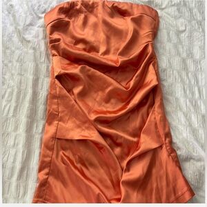 Orange silk mini dress ruched side detail. Zipper on the back. New with Tags